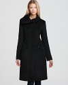 An asymmetric collar lends a modern look to Elie Tahari's Findley coat, crafted with contour seaming for a tailored fit.