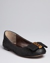 Snakeskin-embossed leather adds sophisticated sass to dainty, bow-embellished ballet flats; by Dolce Vita.