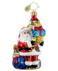 Santa Claus is ready to kick-start Christmas this season with a bunch of brilliantly colored gifts in this hand-painted glass ornament from Christopher Radko.