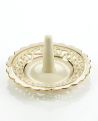 Distinguished by a scalloped edge, bands of gold and heart cutouts in creamy ivory porcelain, this lovely ring holder combines traditional style and timeless grace.