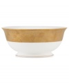 Make any occasion memorable with Gold Dust dinnerware. Combining the urbane style of Donna Karan with the renowned craftsmanship of Lenox, this timeless bone china serving bowl radiates luxury with a wide band of matte-textured gold.