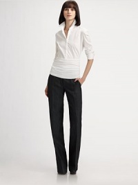 This long sleeve blouse features a crisp tailored top and cummerbund waist giving it a sporty yet chic feel.Shirt collarLong sleeves with button cuffsConcealed button frontFront pleatsRuched bottom panelConcealed side zip74% cotton/21% polyamide/5% elastaneImported of Swiss fabricDry cleanModel shown is 5'9 (175cm) wearing US size 4. 