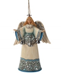 The angel we have heard on high. Set in striking blue & shimmery hues, this welcoming angel exudes a sense of peace and calm, as she stretches her arms forward and showcases a string of glistening silver bells.