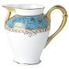 Inspired by the flamboyant designs of the 19th century, Eden Turquoise is both refined and sophisticated. This Limoges porcelain dinnerware service is a remarkable reproduction that captures the beauty of engraved gold work. Made in Limoges, France.