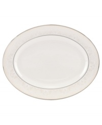 Laced with vintage elegance, the Chapel Hill oval platter features a modern silhouette and prim doily pattern with platinum trim. Fine bone china from kate spade new york ensures a head-turning table setting for dinner parties, holidays and more.