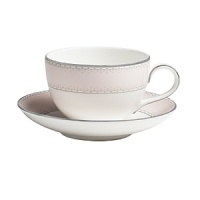 World-renowned fashion designer Monique Lhuillier collaborated with Waterford to create this fine china teacup in beautiful blush tones adapted from her brilliant couture bridal gowns and red carpet creations.