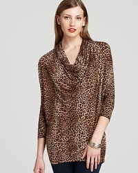 Crisp cheetah print emboldens a decadently draped MICHAEL Michael Kors top for an elegant approach to exotics.