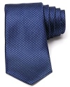 Incredible texture defines this luxurious silk tie from Michael Kors, the perfect pizzazz piece for special occasions or a fine addition to your professional wardrobe.