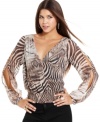 A dangling, gold-toned chain punctuates the open-back design of this super-hot animal-print top from Baby Phat!