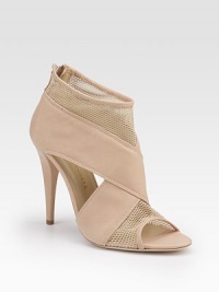 Wide, crisscross leather straps and airy mesh inserts create an intriguing design with cutout sides and a high heel.Self-covered heel 4 (100mm) Peep-toe Back zipper Leather lining and sole Padded insole Made in Italy