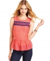 You'll look sweet as can be in Lily White's polka-dot top! Features lace trims and a cute peplum flare.