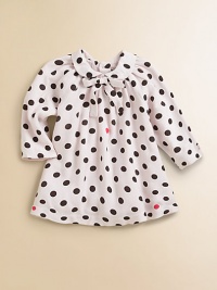 A precious cotton frock with Peter Pan collar and bold polka dots for your little girl.Peter Pan collar with bow tieLong sleevesBack buttonsCottonMachine washImported Please note: Number of buttons may vary depending on size ordered. 