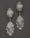 Intricately wrought sterling silver oak leaves form elegant earrings. By Buccellati.