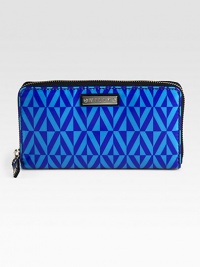 A slim zip-around design of coated fabric with an eye-catching geometric print. Zip-around closureOne inside zip pocketTwo bill compartmentsTwelve credit card slotsFully lined7½W X 4½H X 1DImported