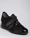 DKNY always delivers looks in step with the athletic trend; these sneakers take things up a notch on wedge heels.