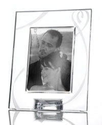 Fall for the elegant True Love giftware collection. A crystal picture frame etched with a romantic heart design is a sweet way to commemorate a special anniversary or congratulate the bride and groom.