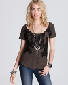 A little tough love goes a long way with this Free People tee, complete with edgy rhinestone and lace embellishments.