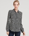 Our obsession with bold animal prints continues with this chic leopard-printed Theory top, rendered in pure silk.