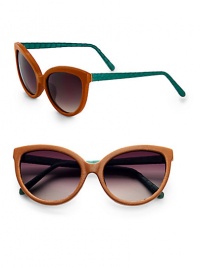 This unique and tactile style features a supple leather, retro-inspired frame with luxurious snakeskin temples. Available in brown leather-green skin with smoke gradient lens. Leather wrapped framesSnakeskin temples100% UV protectionImported