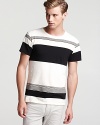 A visually arresting stripe design adorns this handsome tee, a choice option for your everyday wardrobe.