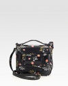 A pretty floral print on textured embossed leather for a vintage-inspired design.Top handle, 2 dropAdjustable shoulder strap, 18-20 dropMagnetic snap flap closureThree inner compartmentsOne inside zip pocketSatin lining8W X 7H X 1¾DMade in Italy