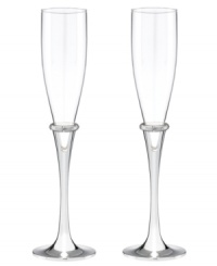 Bands of sparkling rhinestones and silver-plated stems lend modern glamor to Devotion champagne flutes, a beautiful wedding gift from Lenox.