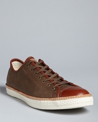 Smooth leather sneakers with handsome contrast trim and cap toe accents keep your look on solid ground.