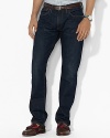 A comfortable classic-fitting jean is washed in antiqued indigo denim for a vintage look.