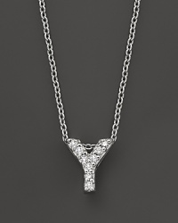 From the Tiny Treasures collection, a diamond Y necklace. With signature ruby accent. Designed by Roberto Coin.