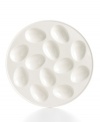 Nest deviled or hard boiled eggs in this Whiteware egg plate from Martha Stewart Collection to prevent accidental rolling. White porcelain ensures a clean, simple presentation fit for any occasion.