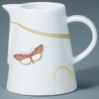 For over two centuries Raynaud has created unique Limoges porcelain, with a marked preference for relief shapes and generously colored and gilt decorations. Metamorphoses is a striking pattern of red and gold with a butterfly motif.