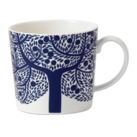 Branch out from the Fable Garland dinnerware pattern with the blue tree accent mug. Featuring distinct Scandinavian style and the sleek durability of Royal Doulton porcelain.