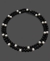 Let the sheer beauty of black and white enchant any outfit. This necklace features luminous cultured freshwater pearls (8-9 mm) and onyx (8-9 mm). Approximate length: 36 inches.