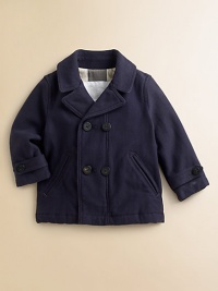 A classic peacoat in sturdy twill, perfect for romps on the playground or even a trip to Grandma's.Notched collar and lapelsDouble-breasted button frontAngled double-welt pocketsButton sleeve tabsCheck liningCottonMachine washImported Please note: Number of buttons may vary depending on size ordered. 