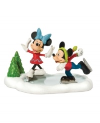 Mickey and Minnie make the most of a winter wonderland, ice skating happily together on a frozen pond in Mickey's Village. From Department 56.