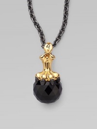 A goldplated sterling silver lion claw, complete wit pavé black cubic zirconia, looms over a jet crystal, strung on a long elegant chain.Jet crystal Cubic zirconia Goldplated sterling silver Black rhodium plated sterling silver Chain length, about 30 Pendant width, about 1½ Lobster clasp Imported