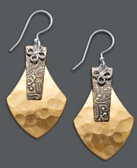 High flying style for the free spirit. Jody Coyote's whimsical drop earrings feature a unique kite shape in hammered bronze with an intricate engraved design and swirling sterling silver setting. Approximate drop: 1-3/4 inches.