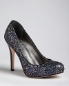 Glitter and a patent heel makes this pair of IVANKA TRUMP platform pumps shine.