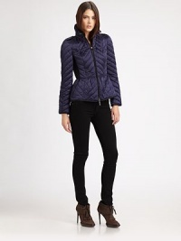 This sporty, quilted puffer style features a slightly flared peplum and crisp contrast piping.Stand collarEpaulettesZip frontContrast pipingContrast side panelsBack button tabsFully linedAbout 23 from shoulder to hemPolyesterImportedModel shown is 5'10 (177cm) wearing US size Small. 