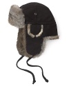 A blended wool exterior is trimmed with luxurious rabbit fur for elegant warmth all winter long.