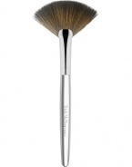 The latest addition to Trish's iconic collection of handcrafted makeup artistry brushes, the flat, arched shape and fine edge of Brush 62 Fan is precision-cut to deposit a whisper of color along the features, a veil of finishing powder to the under-eye, or as a tool to gently fan away fallout for a perfect finish. 