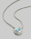 From the Color Classic Collection. A swirled sterling silver cookie pendant, with a faceted center of shimmering blue topaz, on a bold box chain. Blue topaz Sterling silver Chain length, about 16 Pendant diameter, about ½ Lobster clasp Imported