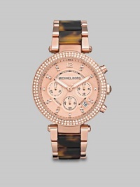 A rose goldtone style with dazzling Swarovski crystal and chic tortoise print accents.Quartz movementWater resistant to 5 ATMRound rose goltone stainless steel case, 39mm (1.5)Crystal accented bezelRose goldtone chronograph dialNumeric and crystal hour markersDate display between 4 and 5 o'clockSecond handRose goldtone stainless steel and tortoise acetate link braceletImported