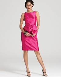 An oversize bow at the waist lends feminine charm to this richly hued and impeccably tailored Carmen Marc Valvo dress.