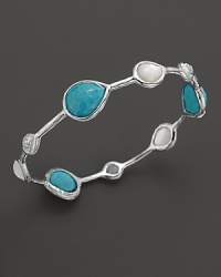 Turquoise stations mingle with clear quartz over mother-of-pearl on this slim silver bangle from the Rock Candy collection by Ippolita.