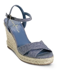 A must-have sandal with a high jute wrapped wedge heel heightens your style and lengthens legs. From Cole Haan.