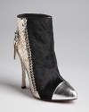 Jet black calf hair and snake embossed leather make a bold pairing on these edgy Jean-Michel Cazabat booties.