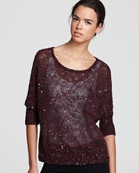 A dash of sparkle, courtesy of sequins, transforms this Aqua sweater into a little something special for the season.