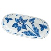 Handmade from terra-cotta and handpainted in Tuscany, this vivid oval platter offers an Italian twist on traditional blue-and-white porcelain for a fresh look on the table.