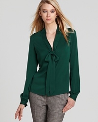 Exude elegance with this Rachel Zoe top finished with a soft bow.